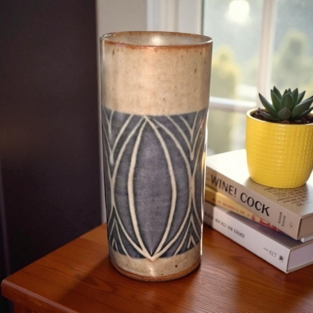 Carved Tumbler artist pottery vase. Artist signed
